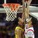 Michigan sophomore Trey Burke fouls as he attempts to block a shot by Louisville senior Peyton Siva during the second half of the national championship game at the Georgia Dome in Atlanta on Monday, April 8, 2013. Melanie Maxwell I AnnArbor.com
